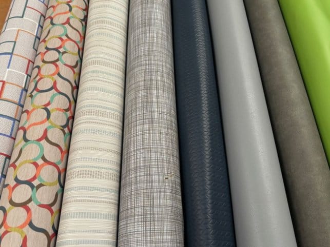 Rolls of vinyl fabric in various colors used for upholstery and waterproof applications