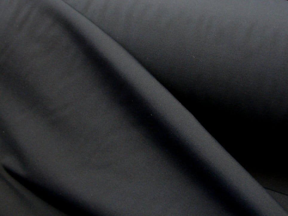 Black nylon fabric with smooth synthetic texture and slight sheen