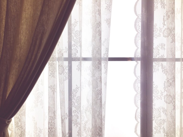 Modern filet lace curtain showing contemporary application in interior design