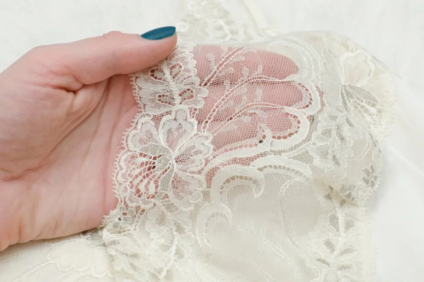 Close-up view of Leavers lace showing intricate pattern details and unique mesh construction