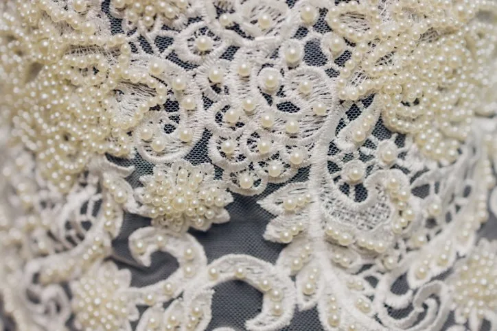 Authentic French lace fabric showcasing intricate patterns and superior craftsmanship