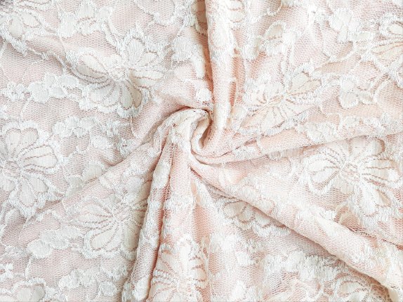 Various types of stretch lace fabric samples showing different patterns and elasticity