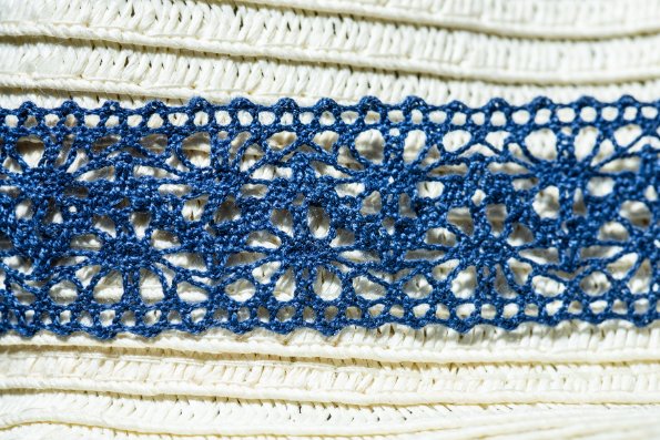 Beautiful examples of tatted lace showing intricate rings and chains patterns