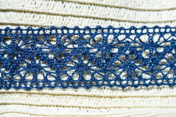 Beautiful examples of tatted lace showing intricate rings and chains patterns