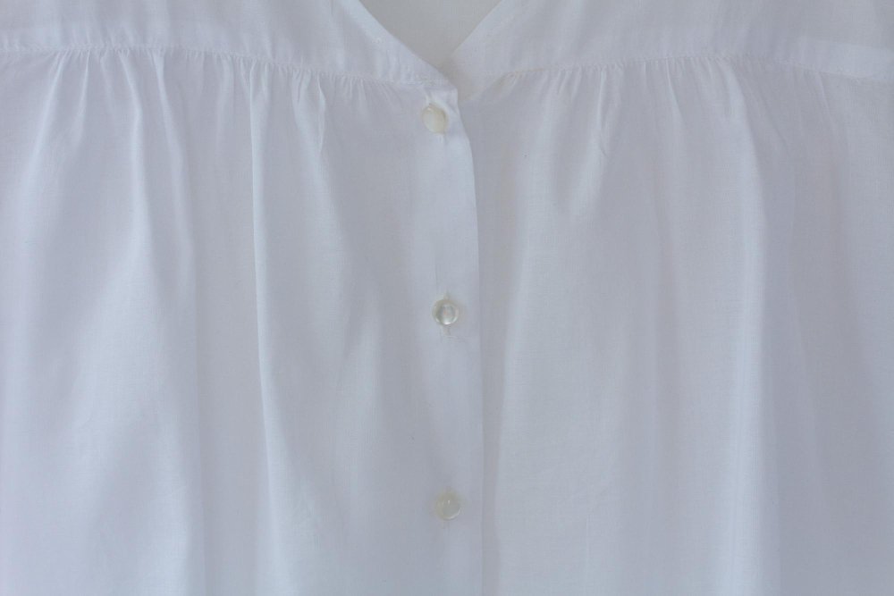 Elegant cotton poplin blouse showcasing the fabric's versatility in fashion applications and professional wear