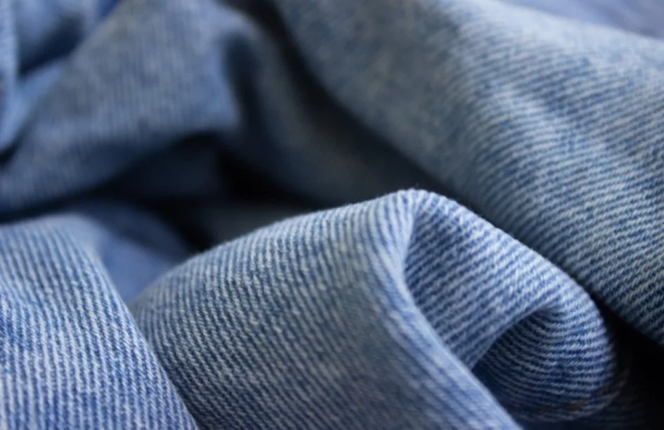 Cotton twill fabric being used in various applications including clothing, upholstery, and accessories