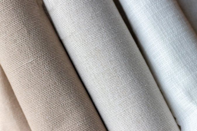 Choosing the Right Fabric - Various cotton fabrics displayed with texture details