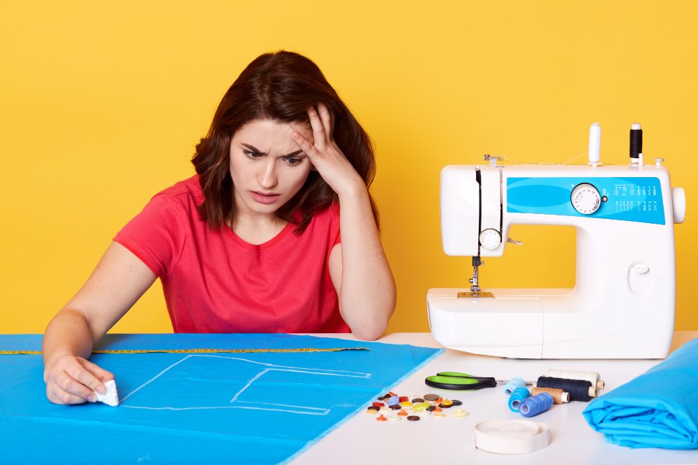 Common sewing problems troubleshooting guide showing tension issues, skipped stitches, and solutions