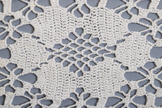 Various types of crochet lace patterns showing different techniques and designs