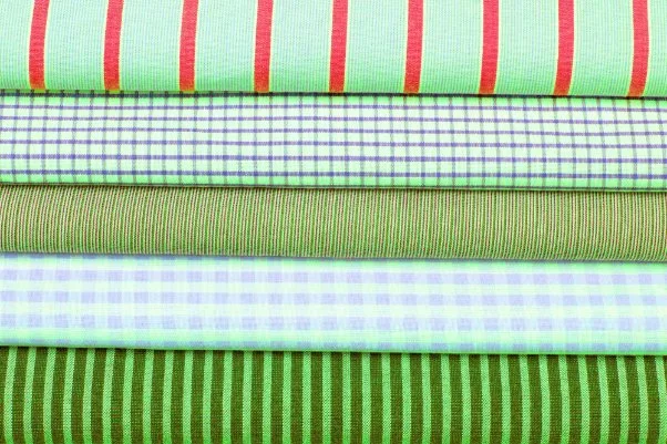 Close-up comparison showing cotton lawn's smooth texture, drape, and breathability features