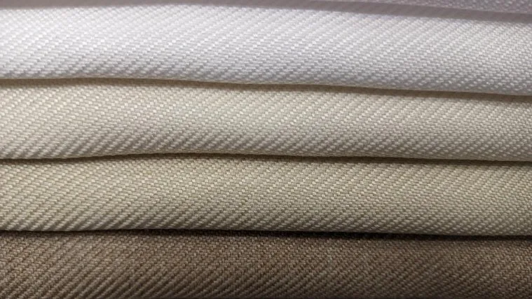 Various cotton twill fabric types arranged by weight from lightweight to heavyweight