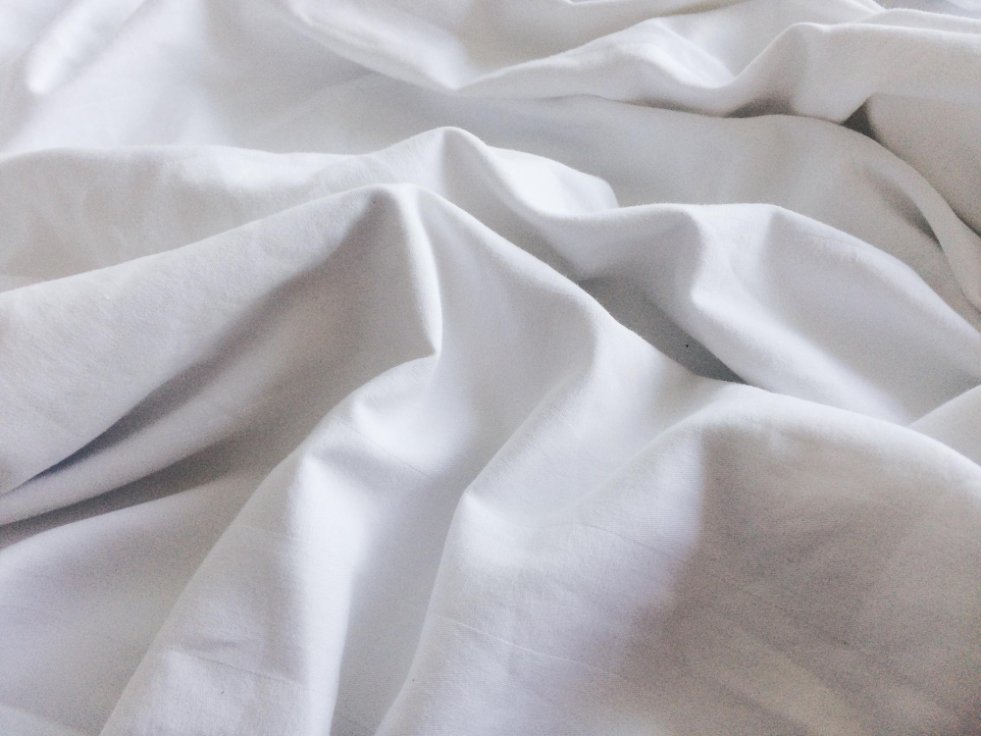Close-up texture comparison showing the difference between regular cotton and brushed cotton fabric