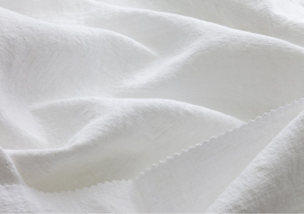 Plain weave linen fabric structure showing warp and weft threads in over-under pattern