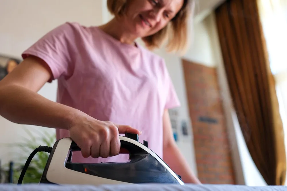 Step-by-step guide showing proper washing, drying, and ironing techniques for damask linen fabric