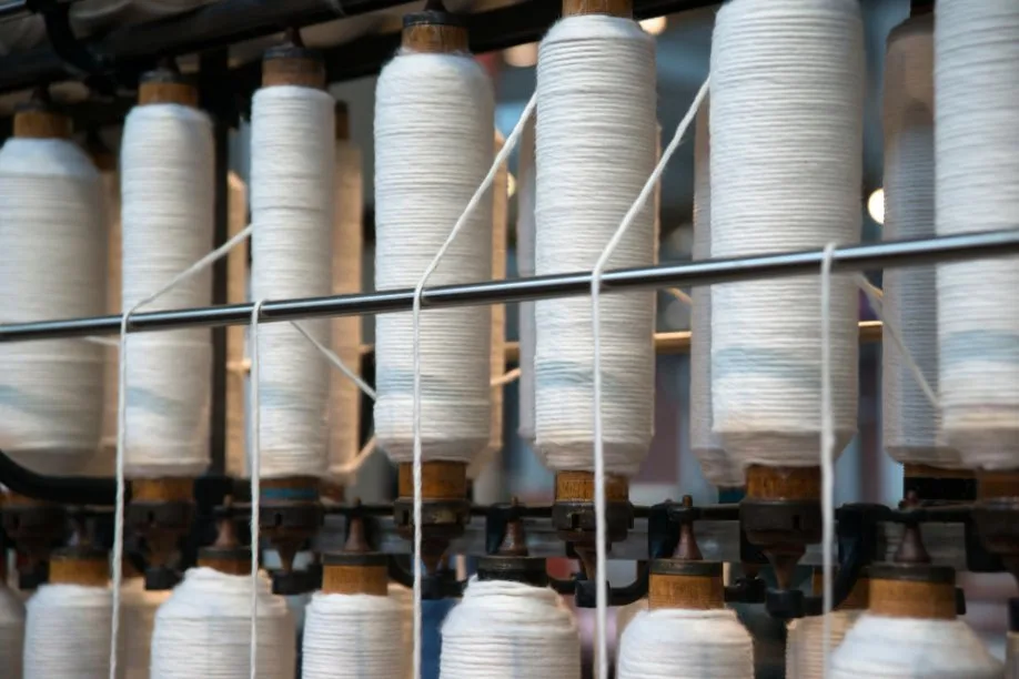 Close-up of boucle yarn showing looped texture and weaving process