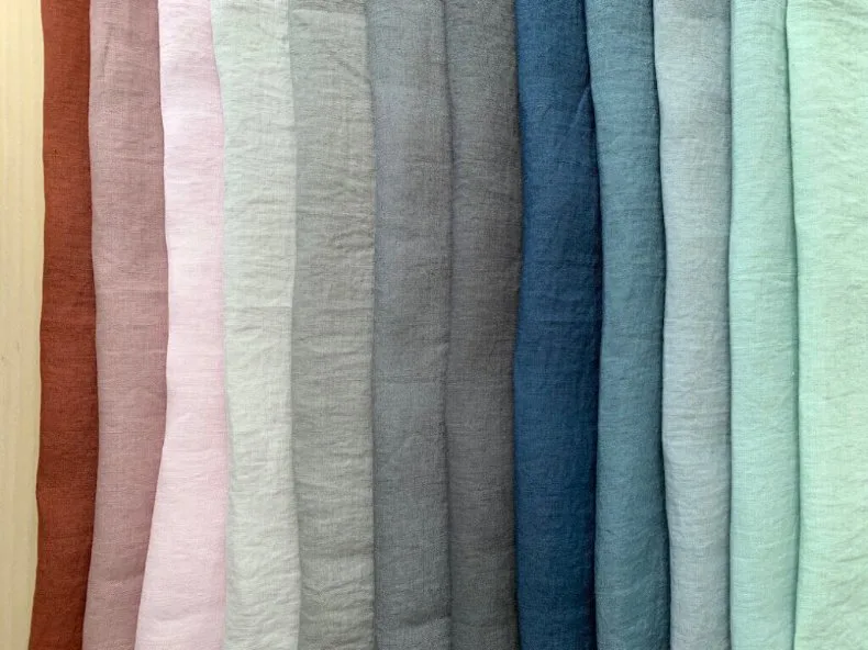 Stonewashed Linen Color Options Array of stonewashed linen fabric samples in various colors including terracotta, blush pink, cream, gray, navy, and mint green