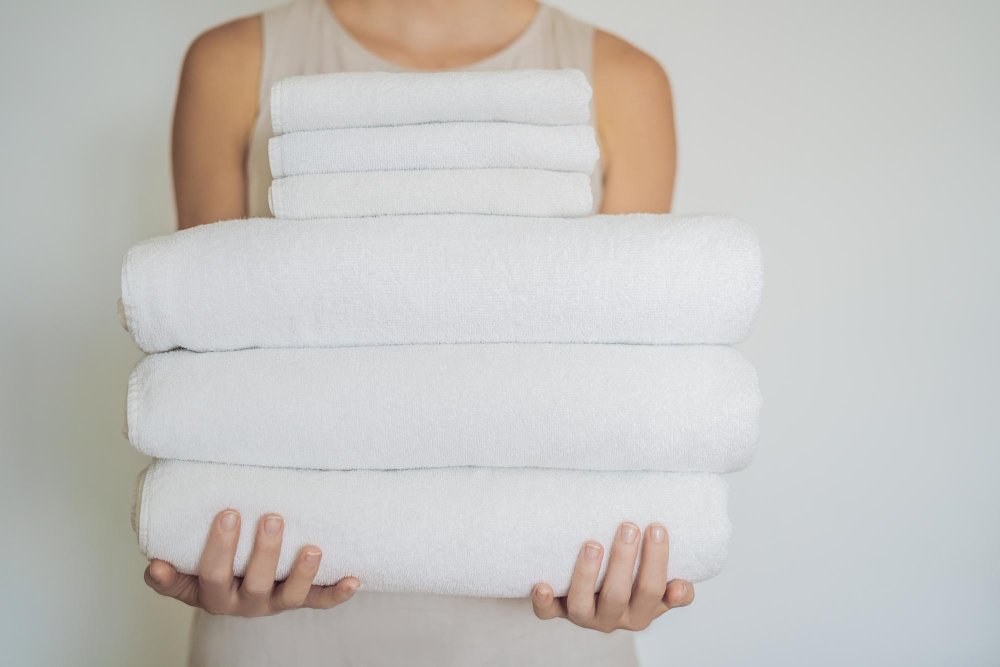 Step-by-step guide showing proper washing and care methods for linen towels