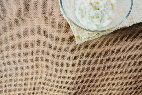 Various kitchen uses of cheesecloth including straining, cheese making, and herb bundling