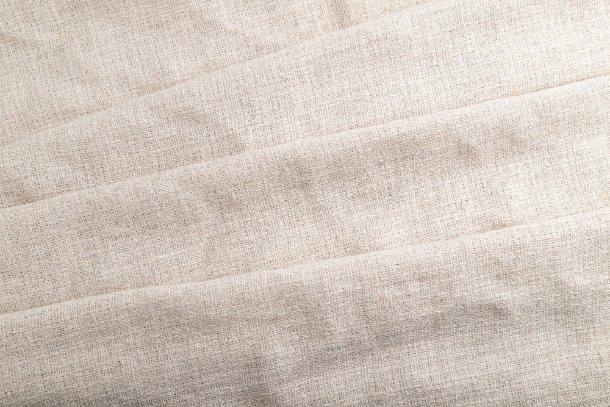 Breathable plain weave linen fabric showing natural texture and moisture-wicking properties