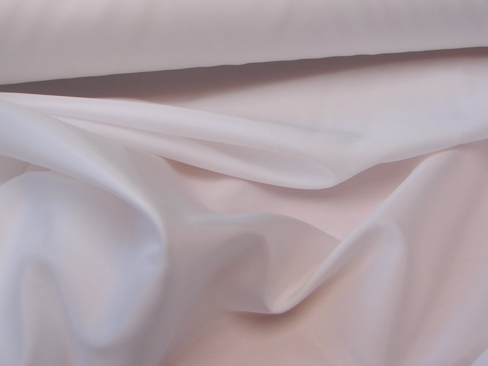 White polyester taffeta fabric draped in soft folds with a smooth surface