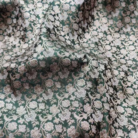 Dark green wool brocade fabric with dense silver floral woven patterns