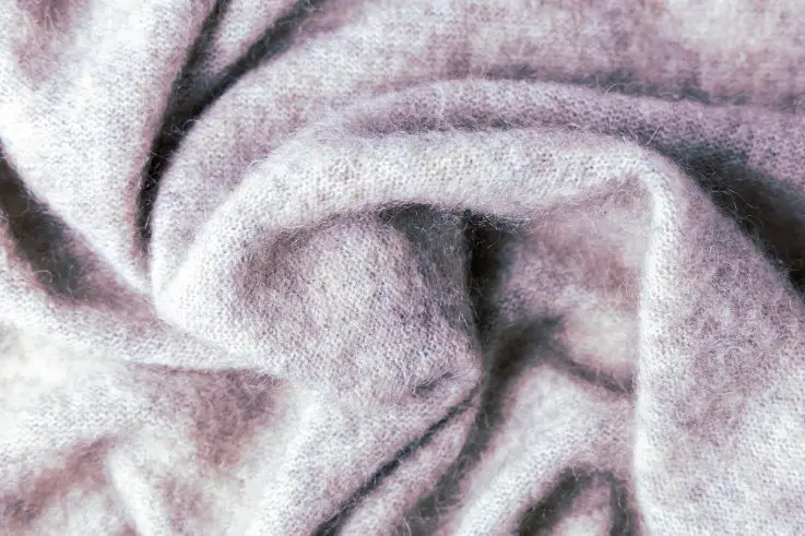 Soft woven cashmere fabric representing the heritage and traditional craftsmanship of cashmere