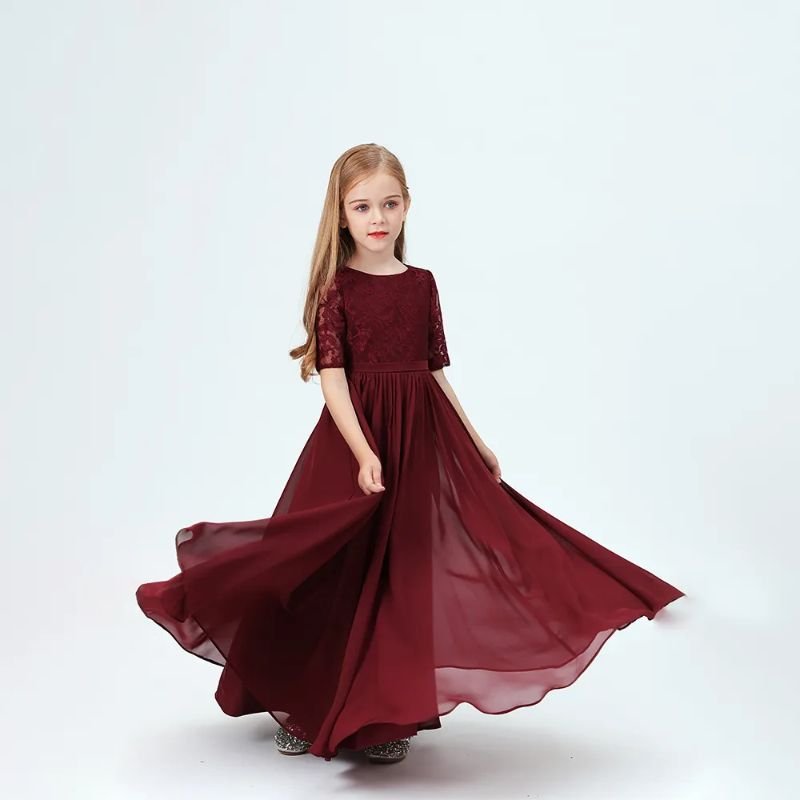 Junior bridesmaid wearing a burgundy chiffon dress suitable for formal settings