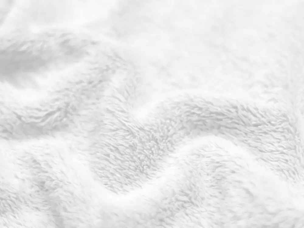 Close up of soft white wool fabric showing fiber texture
