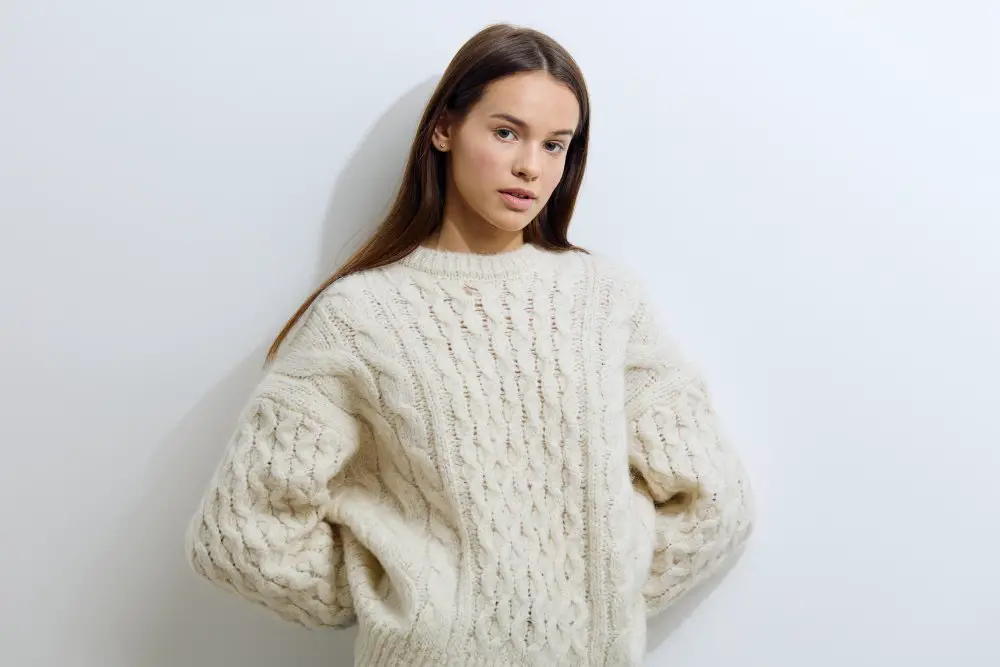 Woman wearing a chunky wool sweater for cold weather fashion