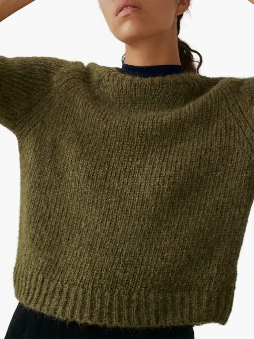 Woman wearing an alpaca wool sweater showing texture and natural drape