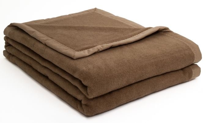 Folded camel wool blanket showing soft texture and rich brown color