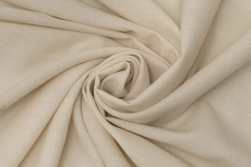 Wool crepe fabric with soft drape and lightly textured surface