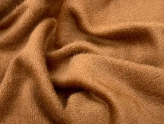 Soft alpaca wool fabric with a smooth brushed texture in warm brown tones