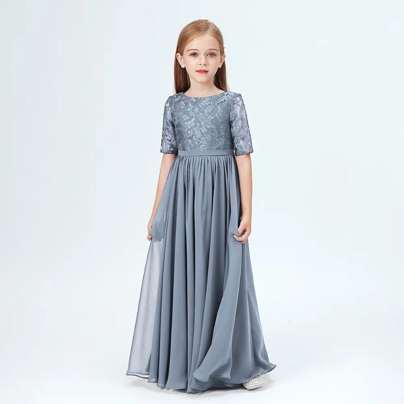 Junior bridesmaid wearing a floor length grey dress with lace top and short sleeves