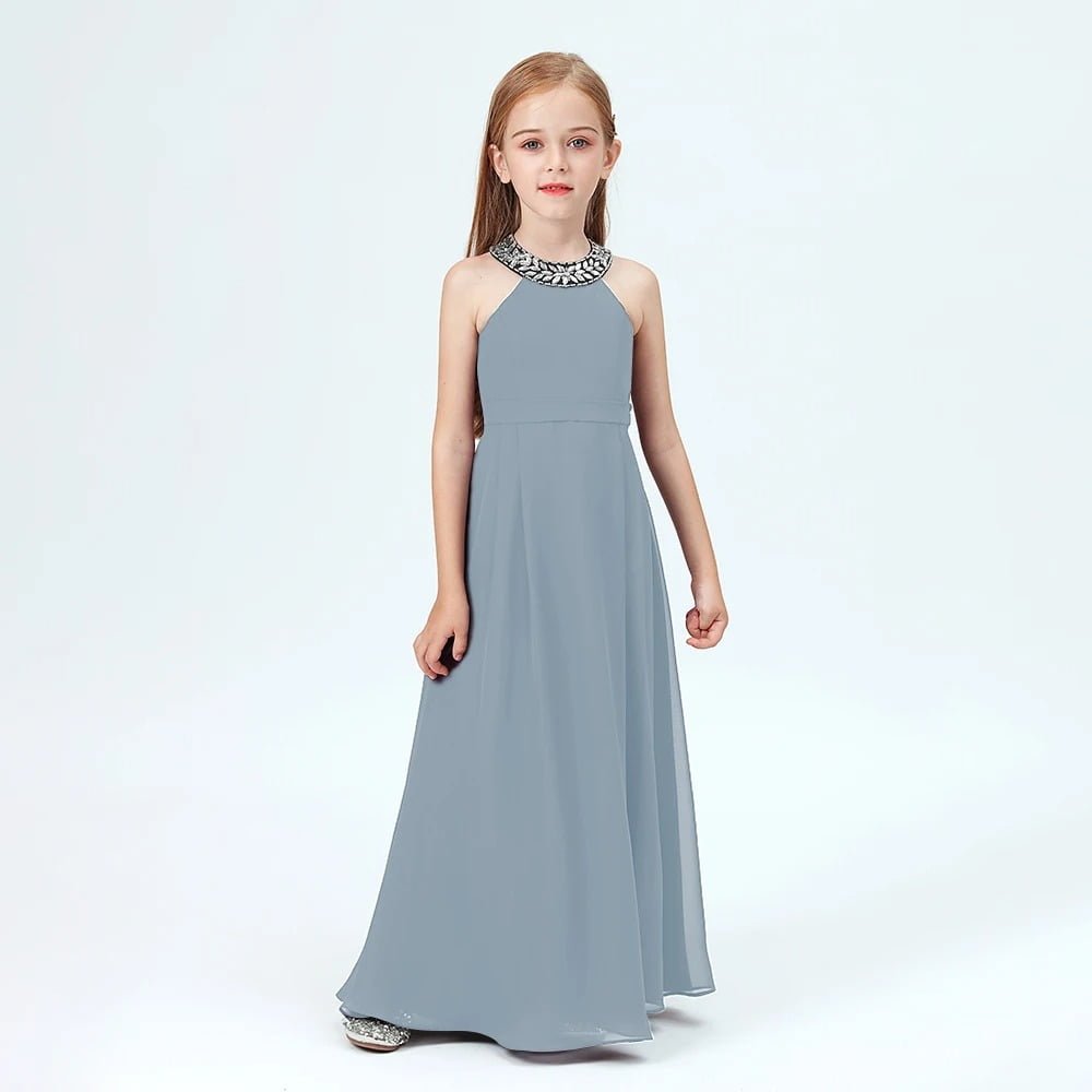 Junior bridesmaid wearing a halter neck grey dress with embellished neckline