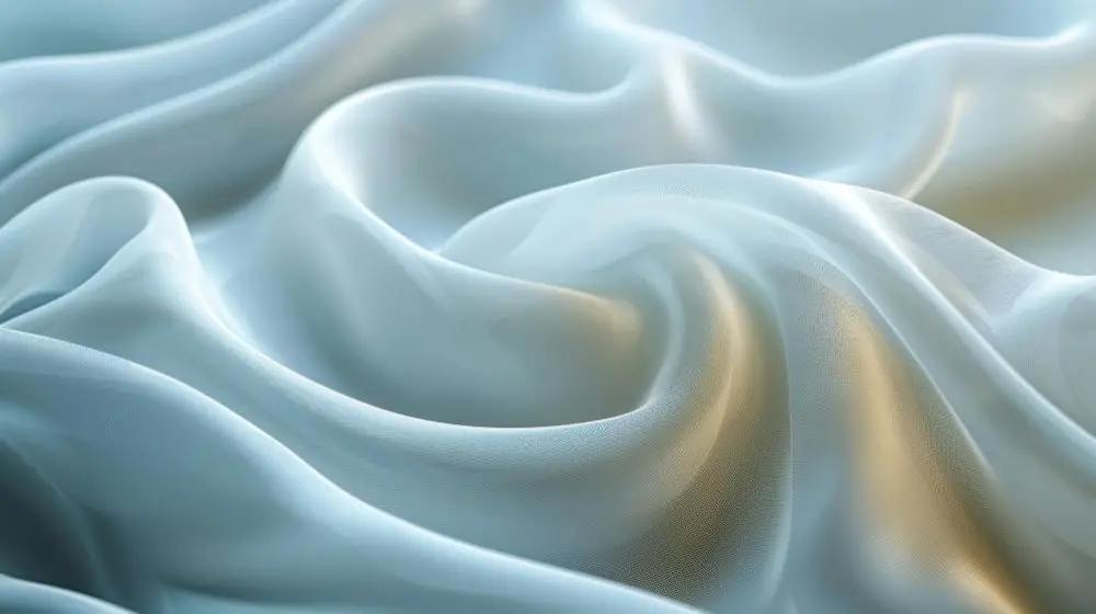 Soft folds of pale blue polyester satin fabric with a smooth shiny surface