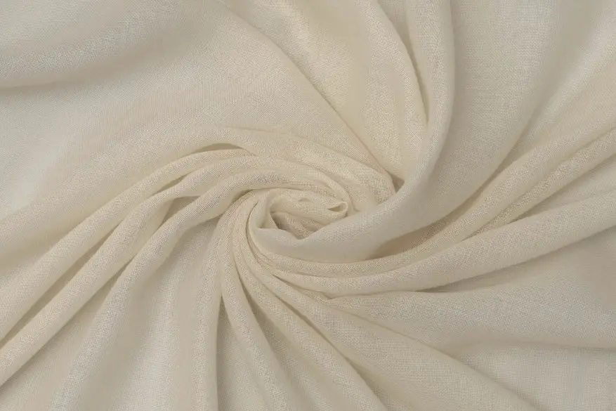 Wool gauze fabric close up showing smooth drape and fine weave