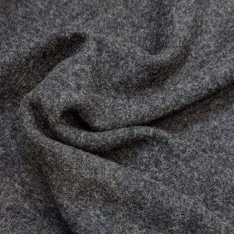 Close up of boiled wool fabric showing dense texture, soft surface, and natural insulating qualities