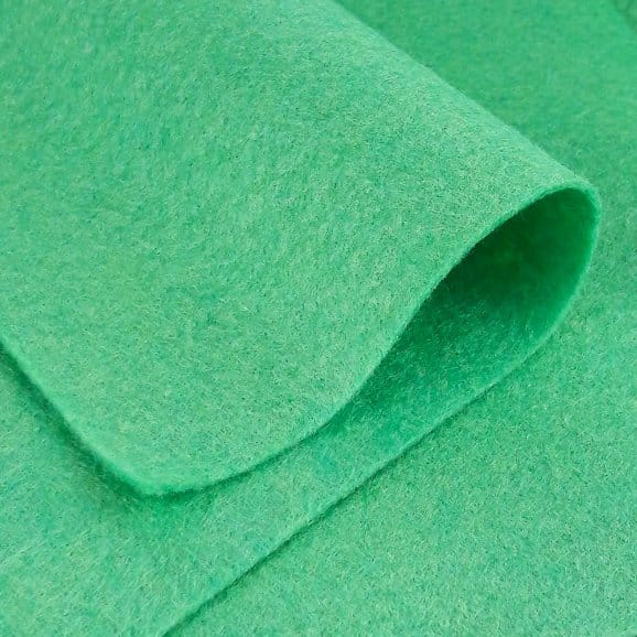 Green felt fabric showing smooth, dense, and non woven wool texture