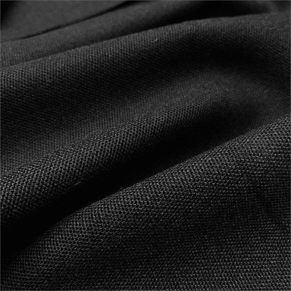 Close up of pure wool barathea fabric showing dense pebbled texture and matte finish. Credit: MacCulloch & Wallis