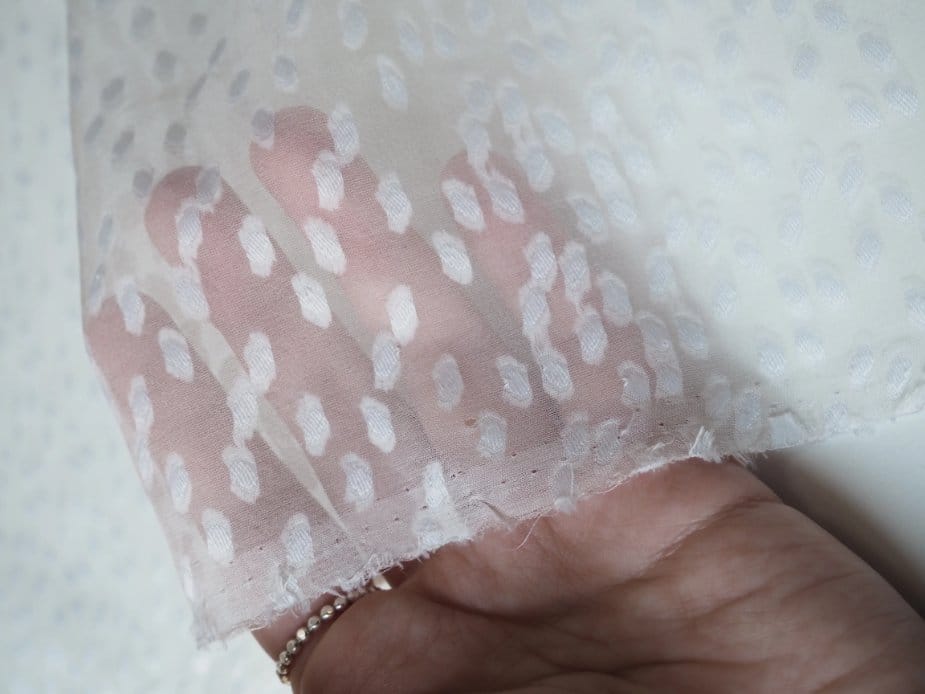 Silk jacquard chiffon fabric with soft sheen woven pattern and sheer texture