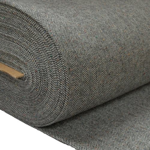 Roll of modern herringbone wool fabric showing refined weave and contemporary finish