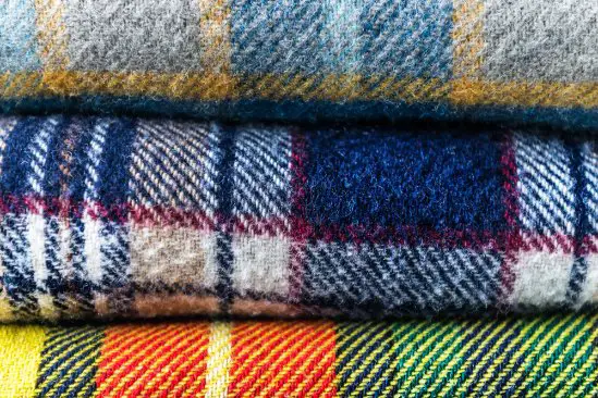 Different wool flannel patterns and textures stacked together