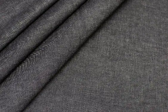 Close up of wool suiting fabric showing fine weave and smooth texture