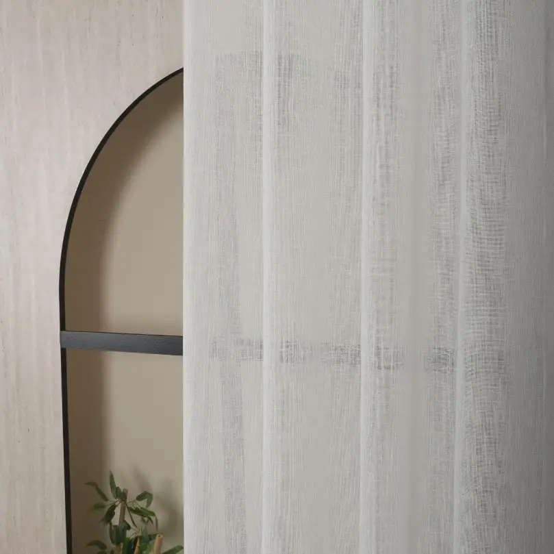 Light curtains made from wool voile fabric showing soft drape and natural light filtration