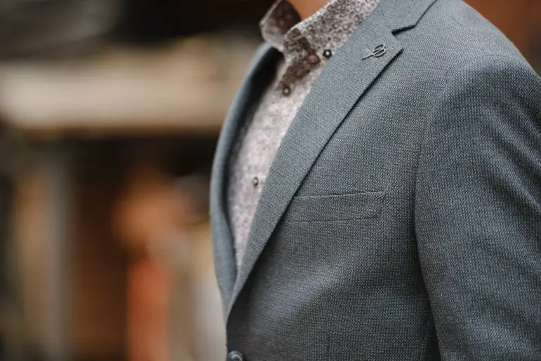 Tailored garment made from wool crepe fabric showing structure and elegant drape