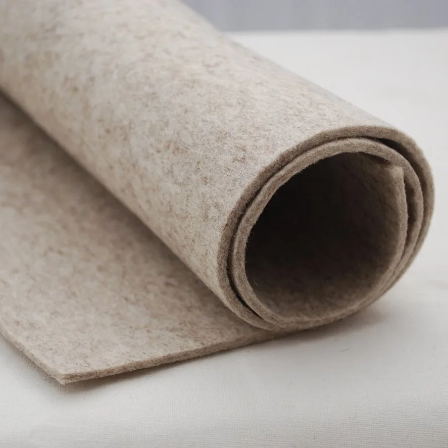Rolled wool felt fabric showing thickness and density that contribute to higher cost