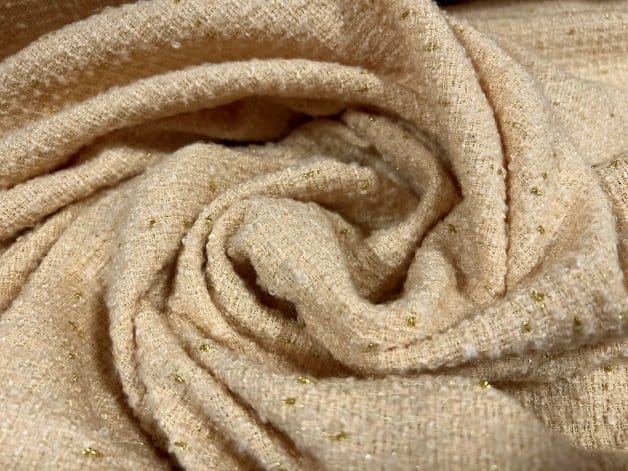 Wool blend bouclé fabric showing looped texture combined with blended fibers for versatility