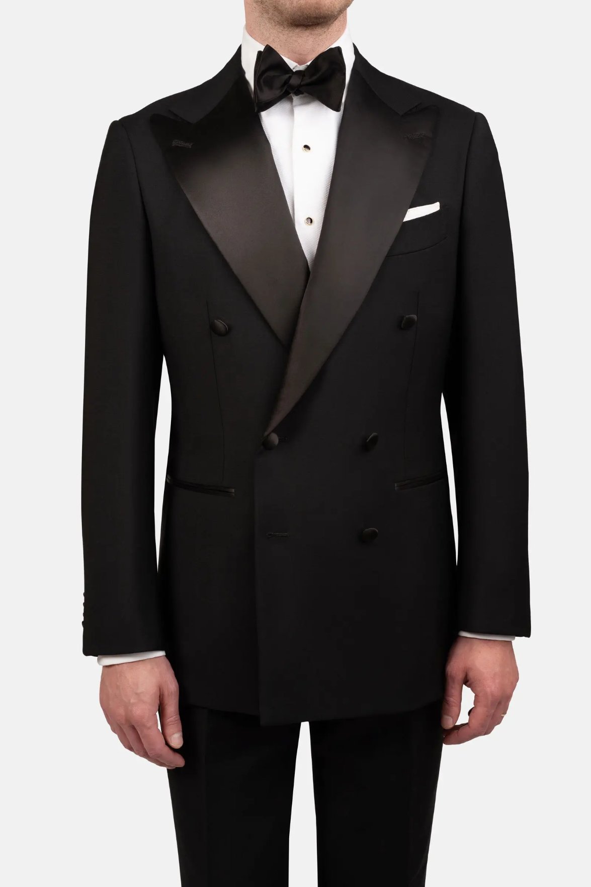 Black tuxedo made from wool barathea with satin lapels and formal detailing. Credit: Cavour