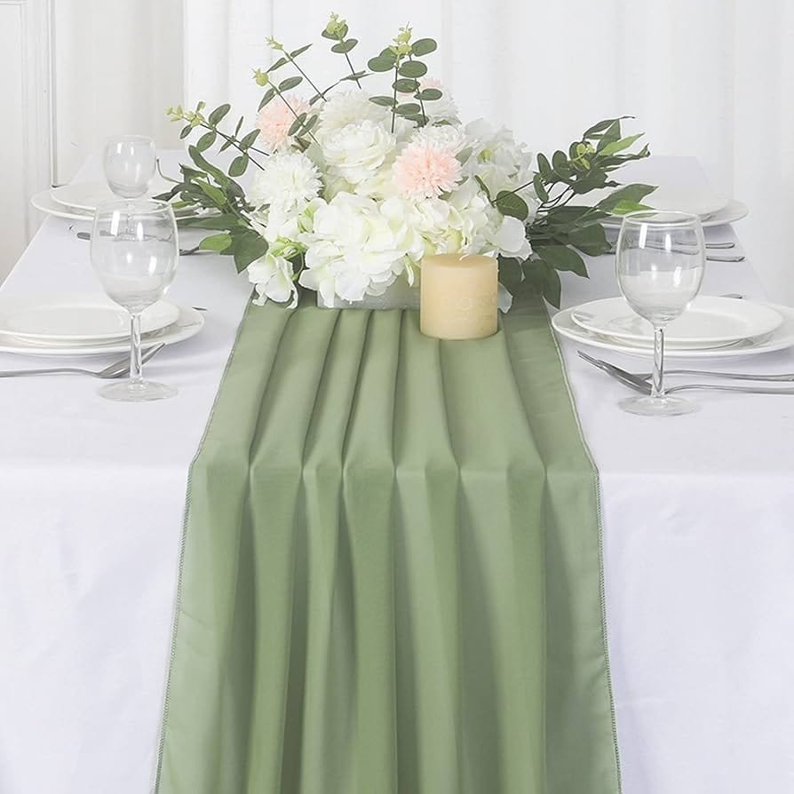 Elegant chiffon table runner used in formal table settings with floral centerpiece